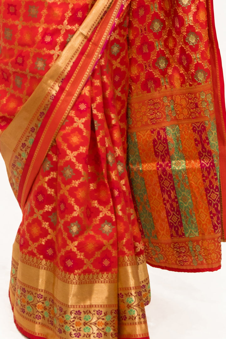 Rust red woven Banarasi Saree
