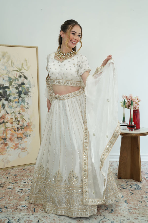 Pristine white gold work Lehenga