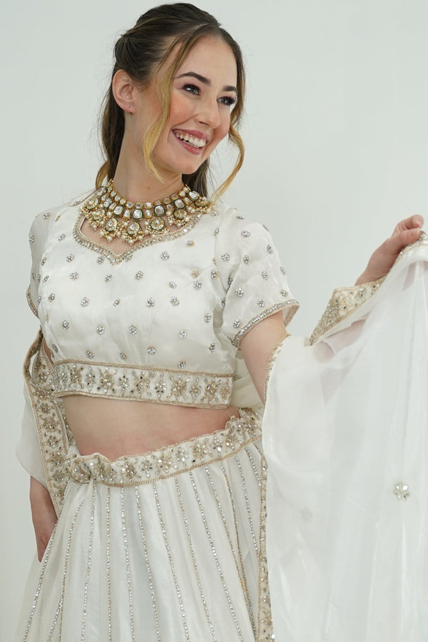 Pristine white gold work Lehenga