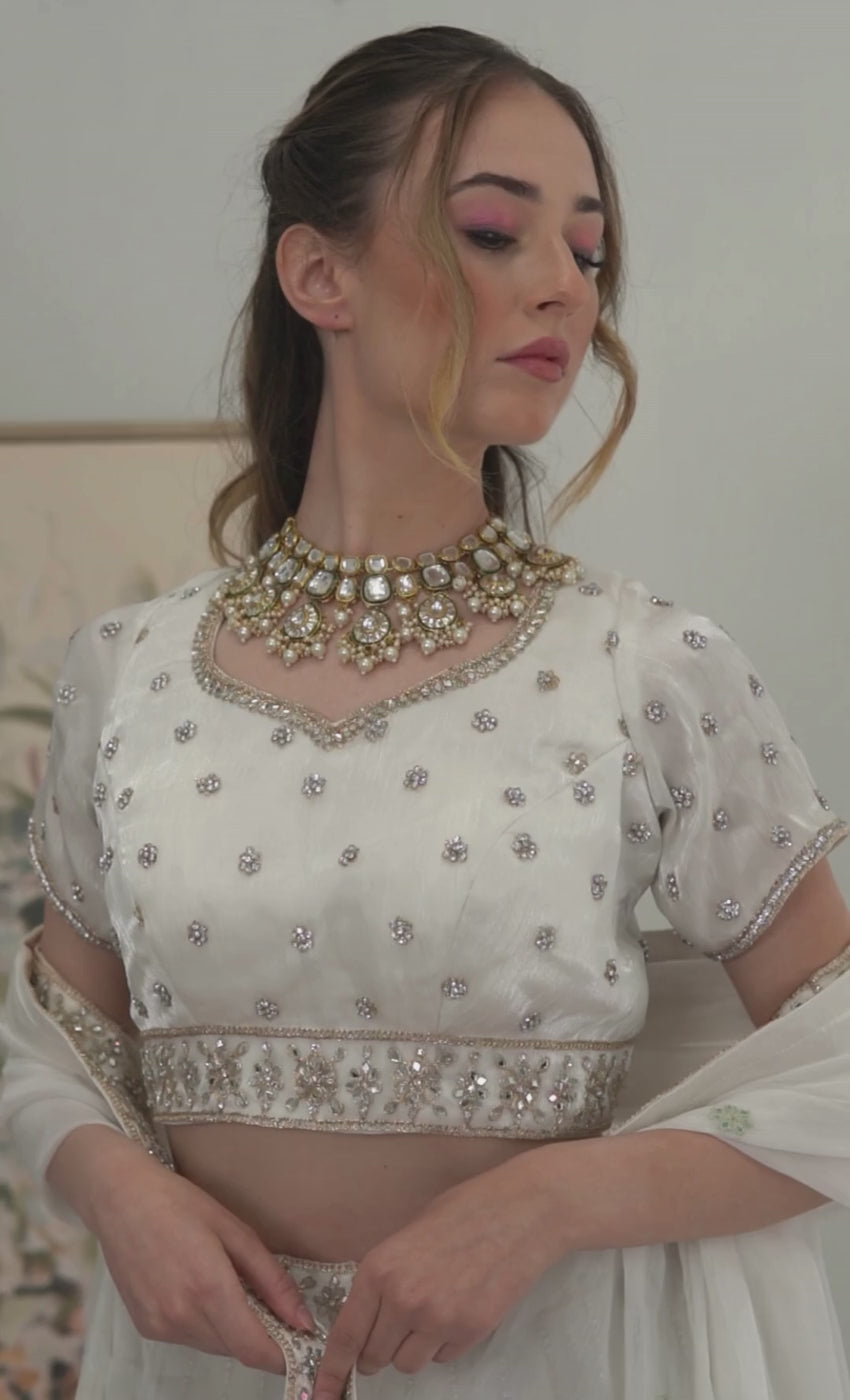 Pristine white gold work Lehenga